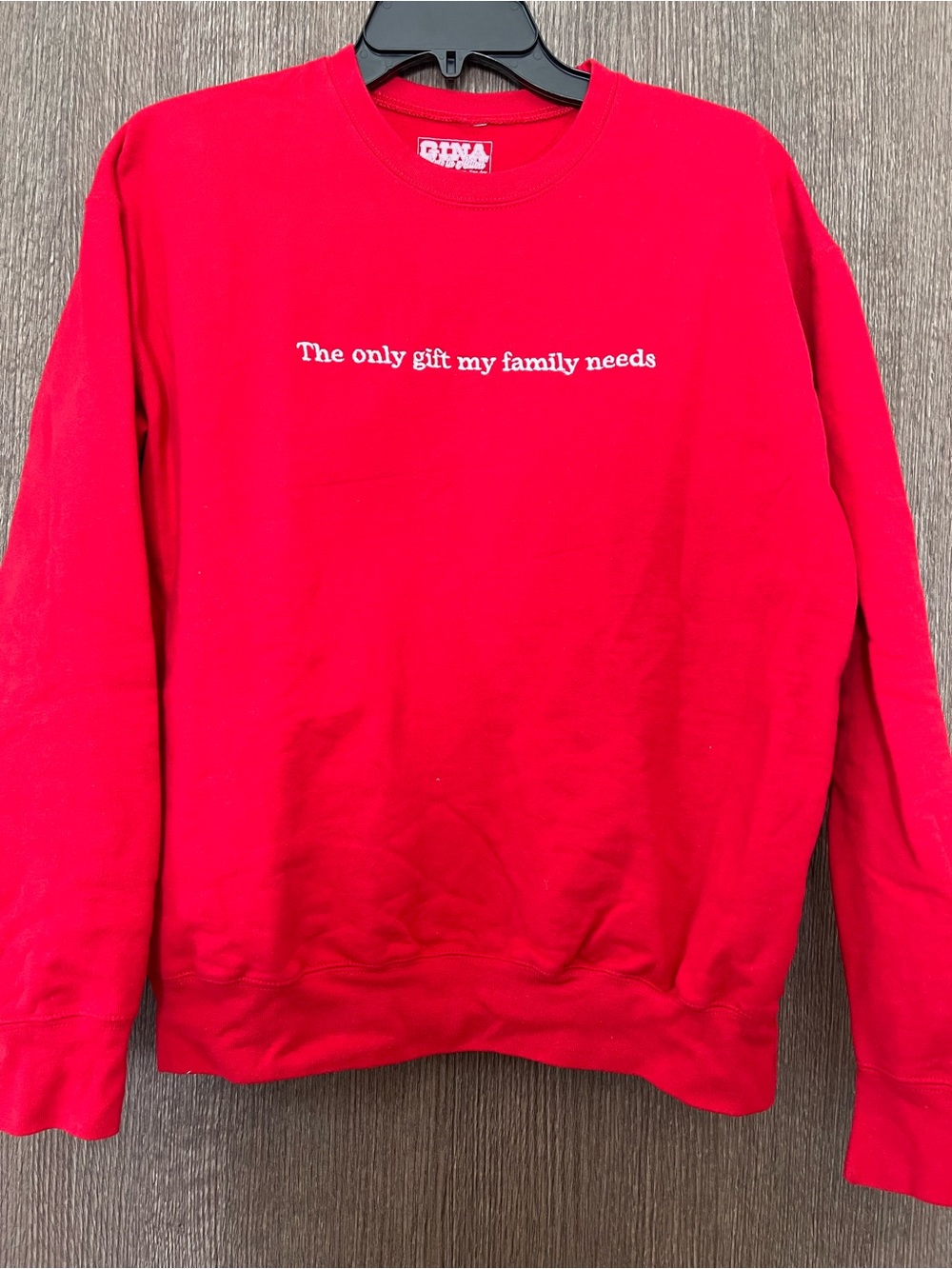 Red Crewneck Sweater with White Script - “The only gift my family needs”